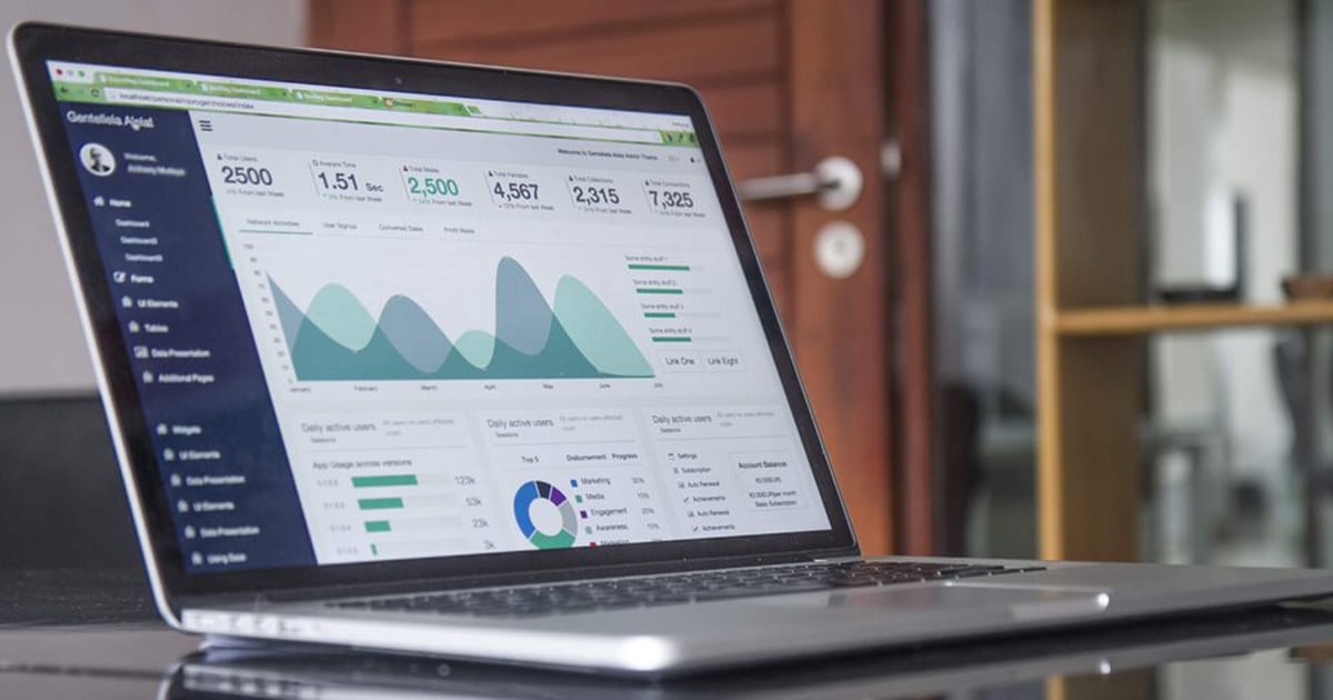 A laptop showcasing SEO analytics, including user engagement and traffic metrics.